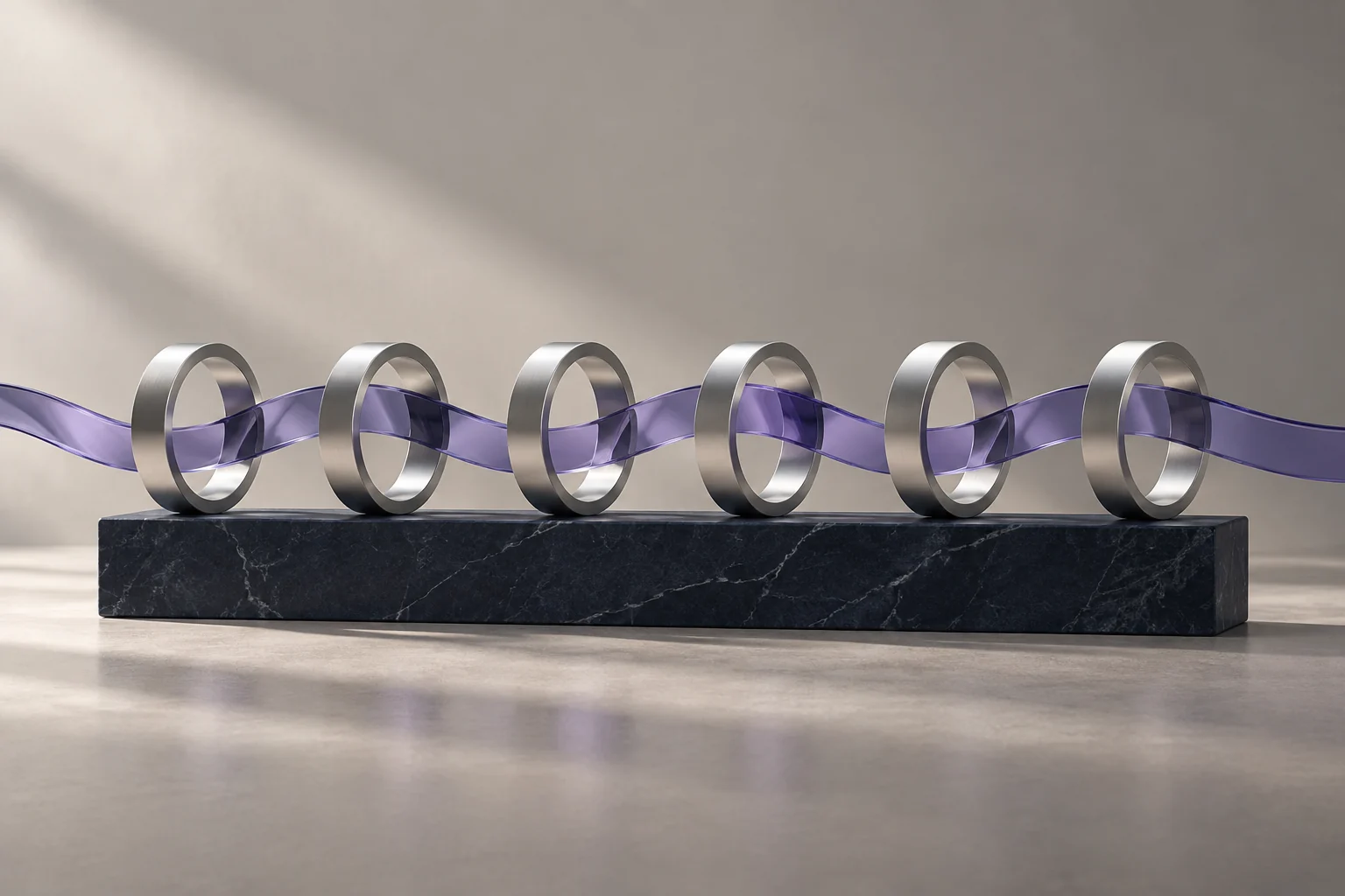 Repeating aluminium rings threaded by a continuous violet ribbon
